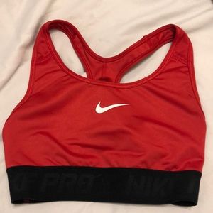 Red and black Nike Pro sports bra